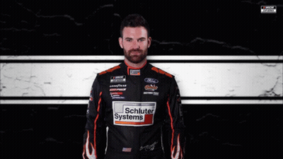 Man In Schluter Systems Jacket At Race Track GIF