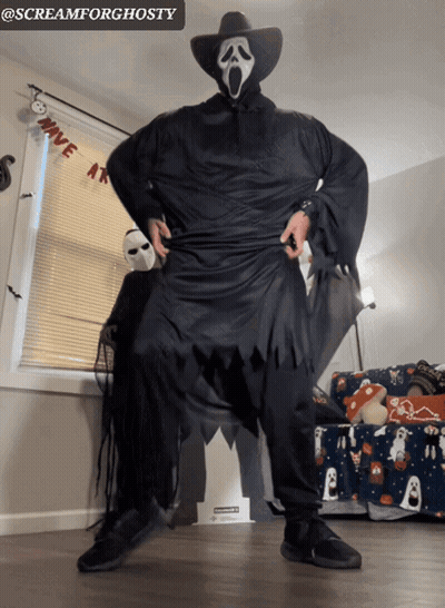 Man In Scream Costume With Have At Banner GIF