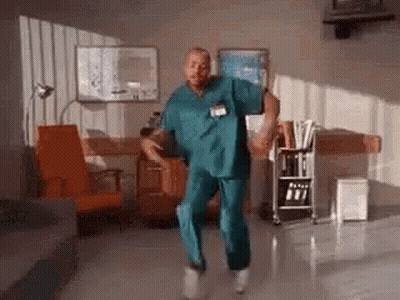 Man In Scrub Suit Dancing In Hospital Room GIF