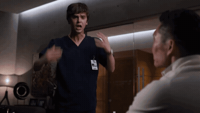 Man In Scrub Top With Name Tag Saying Dr GIF