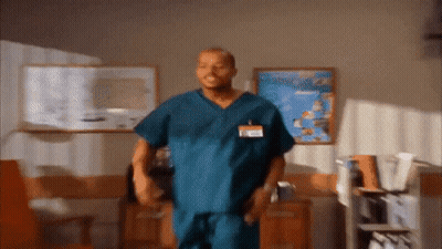Man In Scrub With Name Tag Saying A GIF
