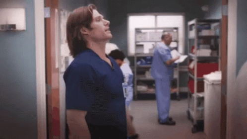 Man In Scrubs With Surgeon Name Tag GIF