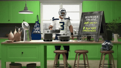 Man In Seahawks Jersey In Front Of Chalkboard Saying 8 Playoff Appearances GIF