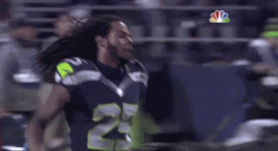 Man In Seahawks Jersey Standing On Field GIF