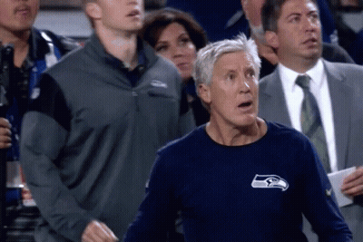 Man In Seahawks Shirt Standing In Crowd GIF