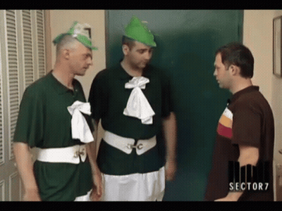 Man In Sector 7 Shirt Talks To Two Men In Green Shirts GIF