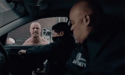 Man In Security Jacket In Car GIF