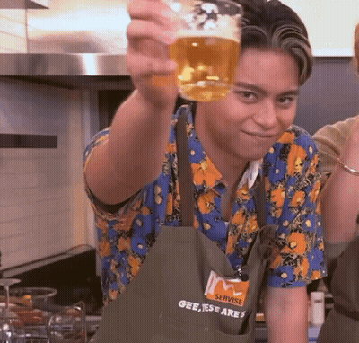 Man In Servise Apron Holding Beer GIF