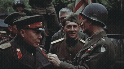 Man in SG Helmet Talks to Soldier