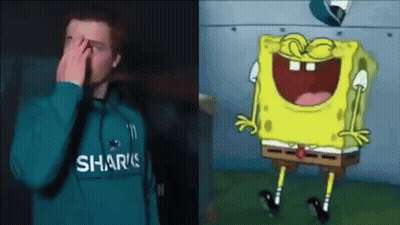Man In Sharks Sweatshirt Covering Face Beside Laughing SpongeBob GIF