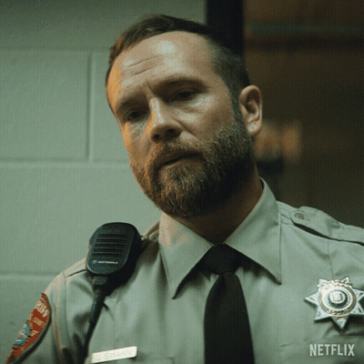Man In Sheriff Uniform With Netflix Logo GIF