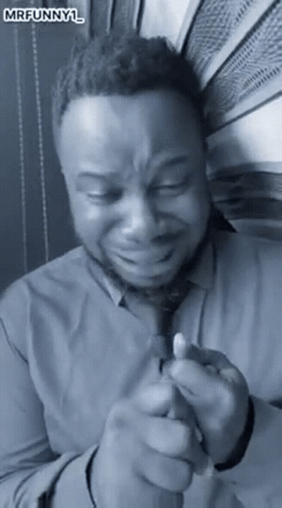 Man In Shirt And Tie Crying Holding Lighter GIF