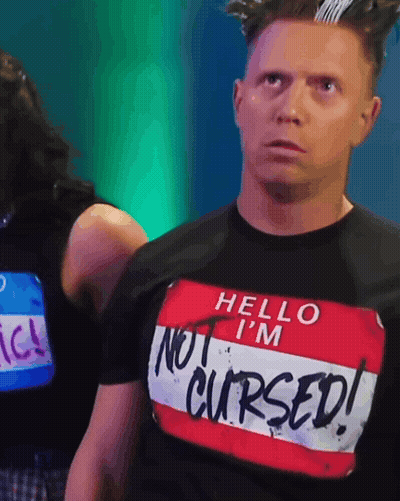 Man In Shirt Saying Hello I'm Not Cursed GIF