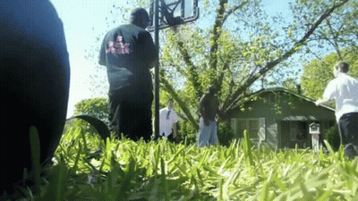 Man In Shirt Saying Jesus Loves You In Grass GIF