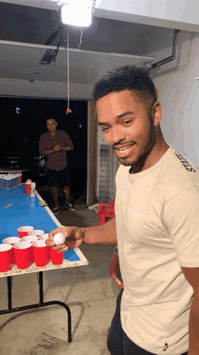 Man In Shirt Saying Stiffs On Sleeve GIF