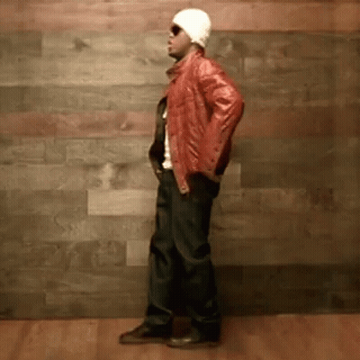 Man In Shirt With Lion On Back Talking To Another Man GIF