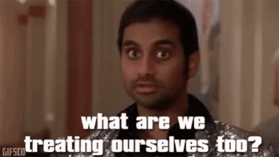 Man In Silver Suit Asking What Are We Treating Ourselves To GIF