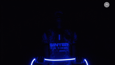 Man In Sinter Fan Token Jersey Holding Light GIF