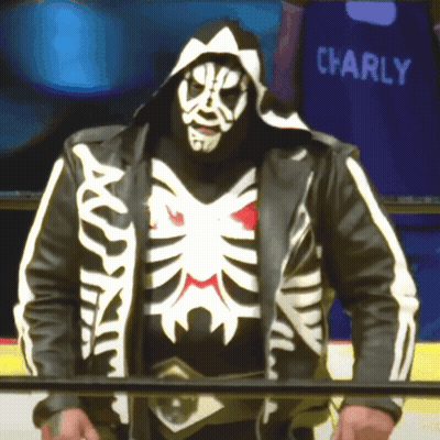 Man In Skeleton Costume In Front Of Blue Charly Shirt GIF