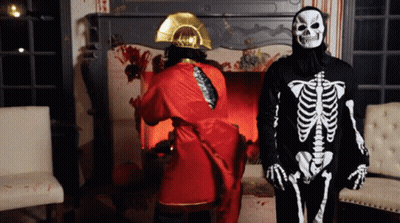 Man In Skeleton Costume Next To Man In Red Robe GIF