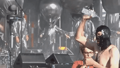 Man In Ski Mask Holding Another Man's Arm GIF