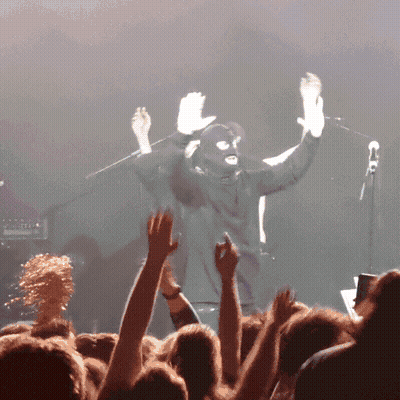 Man In Ski Mask In Front Of Crowd GIF