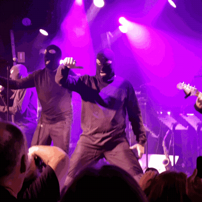 Man In Ski Mask Singing Into Microphone GIF