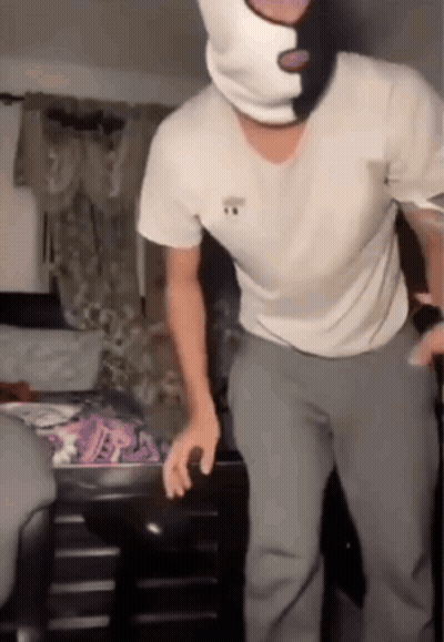 Man In Ski Mask Standing In Bedroom GIF