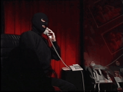 Man In Ski Mask Talking On Phone GIF