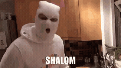 Man In Ski Mask With Shalom On Shirt In Kitchen GIF
