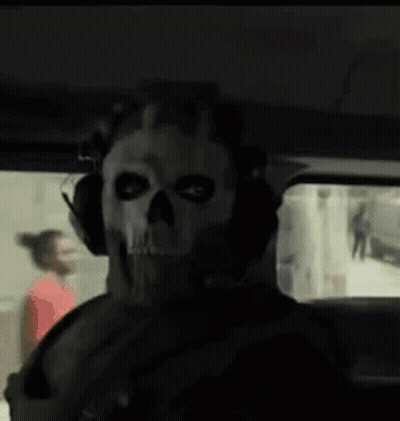 Man In Skull Mask And Headphones Sitting In Car GIF