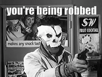 Man In Skull Mask Holding Gun By Refrigerator GIF