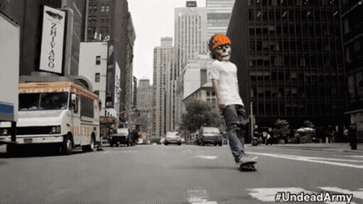 Man In Skull Mask Riding Skateboard GIF