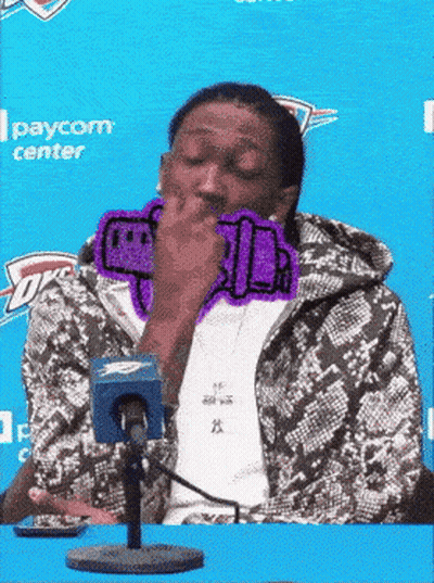 Man In Snakeskin Jacket Covering Mouth At Microphone GIF