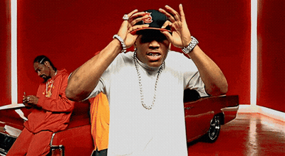 Man In Snoop Dogg Hat Standing By Red Car GIF