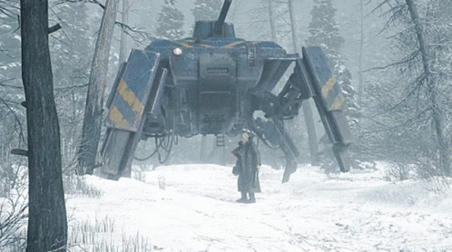 Man In Snow In Front Of Giant Robot Saying Army GIF