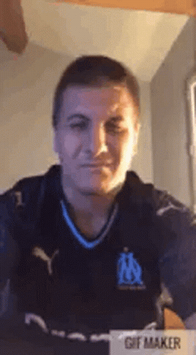 Man In Soccer Jersey Taking Selfie GIF