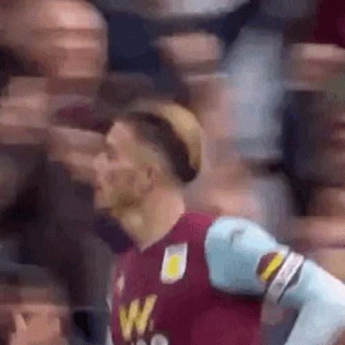 Man In Soccer Uniform Facing Crowd GIF