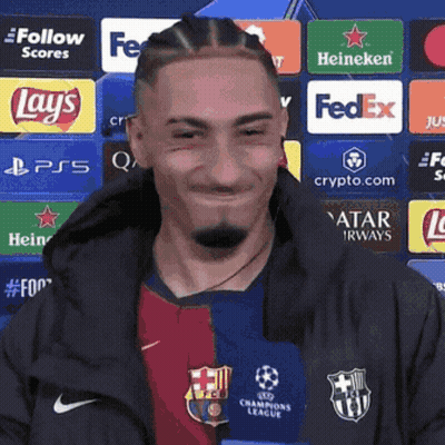 Man In Soccer Uniform Smiling In Front Of FedEx Lays Heineken Ads GIF