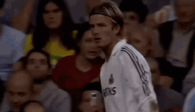 Man In Soccer Uniform Standing In Crowd GIF
