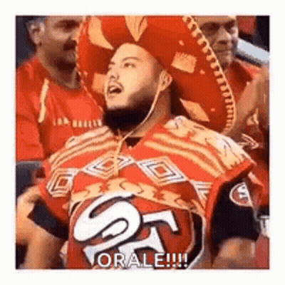 Man In Sombrero And 49Ers Jersey Sitting In Stadium GIF