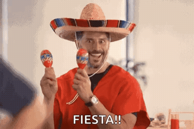 Man In Sombrero And Poncho Holding Maracas GIF
