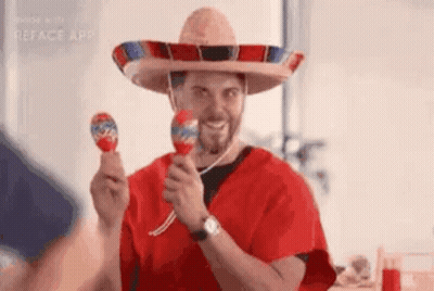 Man In Sombrero Holding Maracas GIF