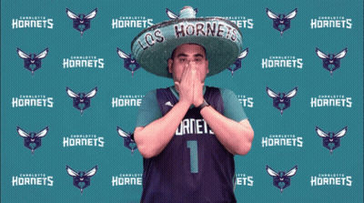 Man In Sombrero In Front Of Charlotte Hornets Backdrop GIF