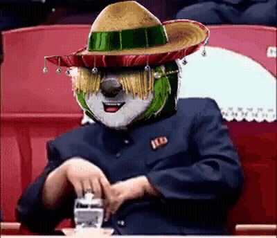 Man In Sombrero Sitting At Table GIF
