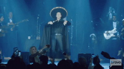 Man In Sombrero Standing On Stage GIF