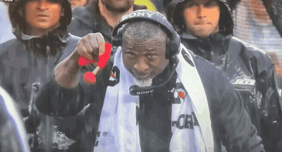 Man in Sony Headset Holding Red Object