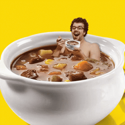 Man In Soup Bowl Holding Spoon GIF