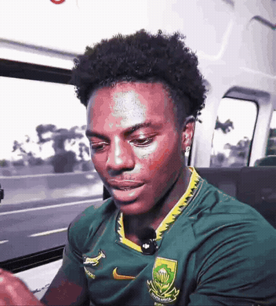 Man in South Africa Jersey Looking Down