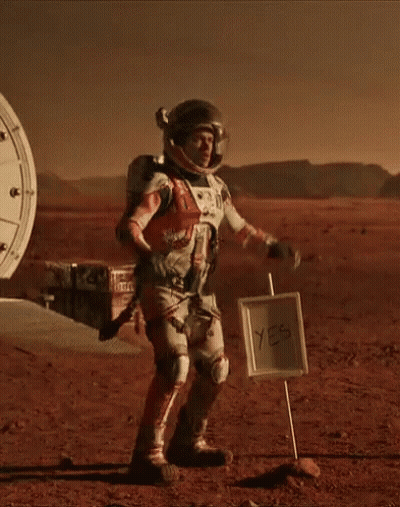 Man In Space Suit Next To Yes Sign GIF